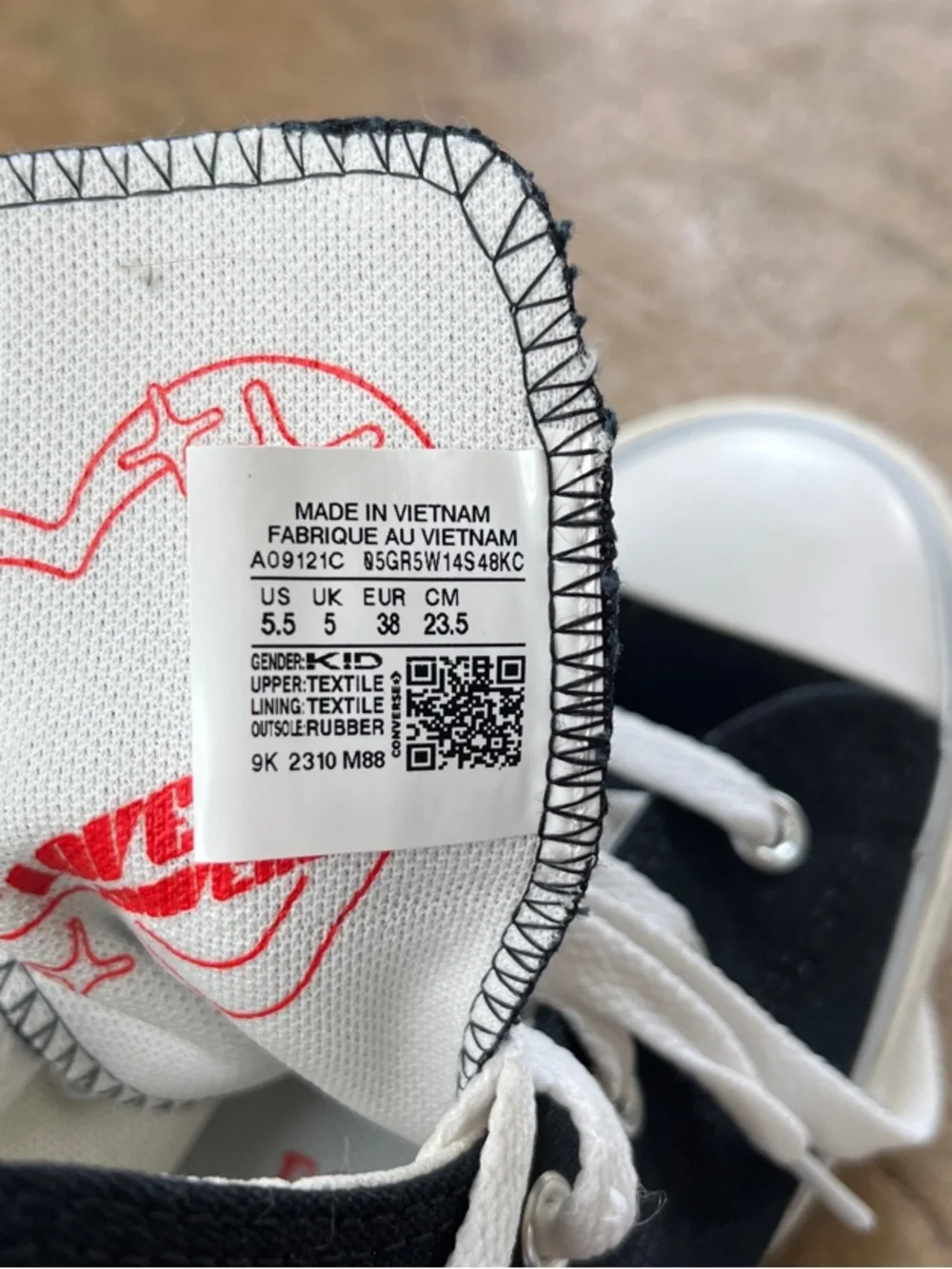 Converse Kids Black High-Top Sneakers with White Soles and Red Heart Details